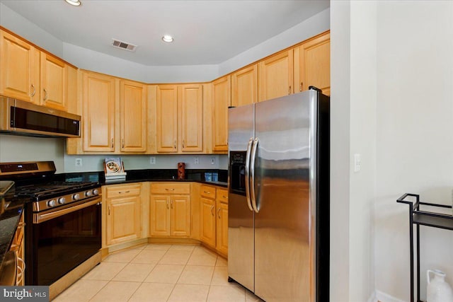 12000 Market St Unit 189, Reston, VA 20190 - kitchen with stainless steel appliances, light brown cabinetry, and visible vents