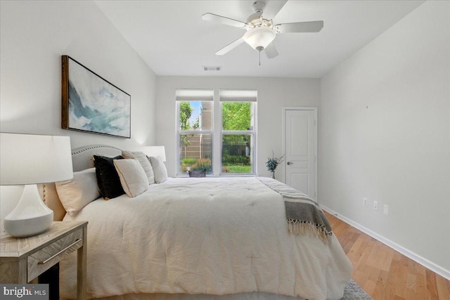 12000 Market St Unit 189, Reston, VA 20190 - bedroom featuring baseboards, a ceiling fan, visible vents, and light wood-style floors