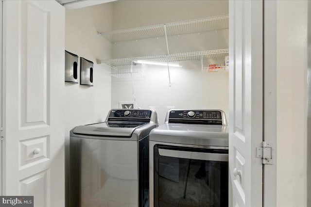 12000 Market St Unit 189, Reston, VA 20190 - clothes washing area with laundry area and washer and clothes dryer