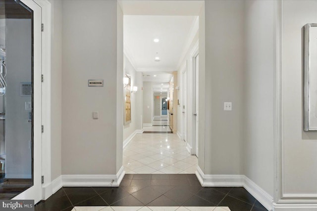 12000 Market St Unit 189, Reston, VA 20190 - hall featuring ornamental molding, recessed lighting, tile patterned flooring, arched walkways, and baseboards