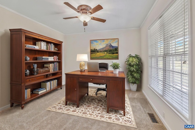 office space with ceiling fan, light carpet, visible vents, and plenty of natural light