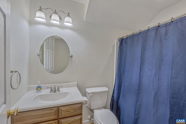 bathroom featuring lofted ceiling, toilet, vanity, and a shower with curtain