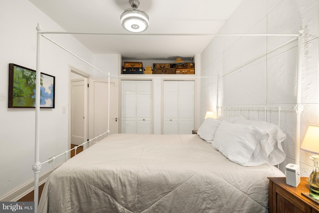 bedroom with two closets