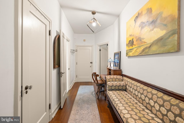 hall with dark wood-style floors