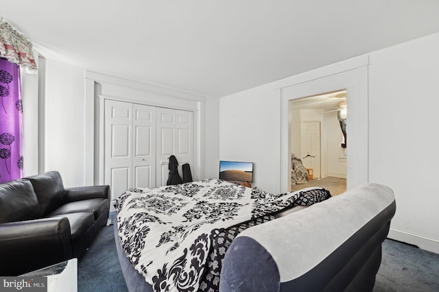 bedroom featuring a closet and carpet