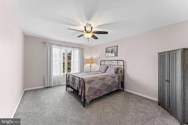 bedroom with carpet, baseboards, and ceiling fan
