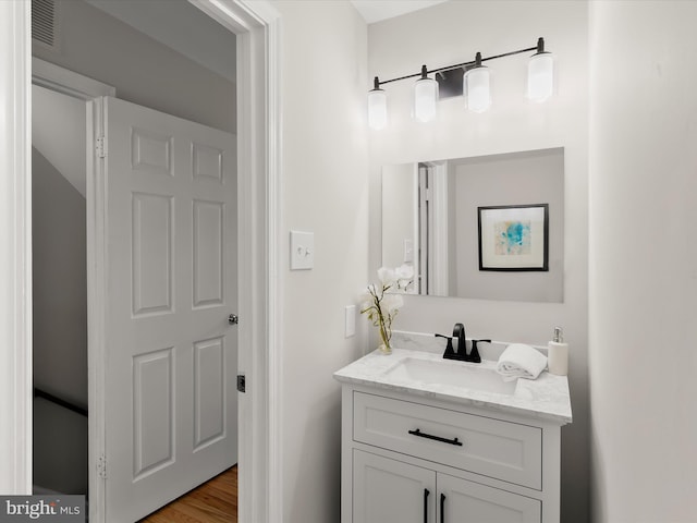 2607 Nisqually Ct, Silver Spring, MD 20906 - bathroom featuring visible vents, wood finished floors, and vanity
