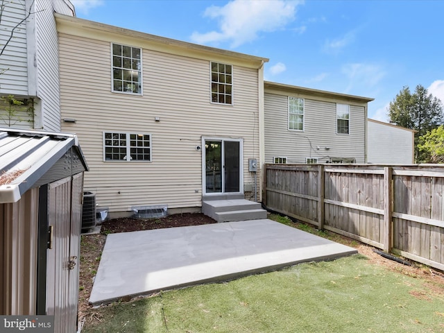 2607 Nisqually Ct, Silver Spring, MD 20906 - rear view of property with cooling unit, a patio area, and fence