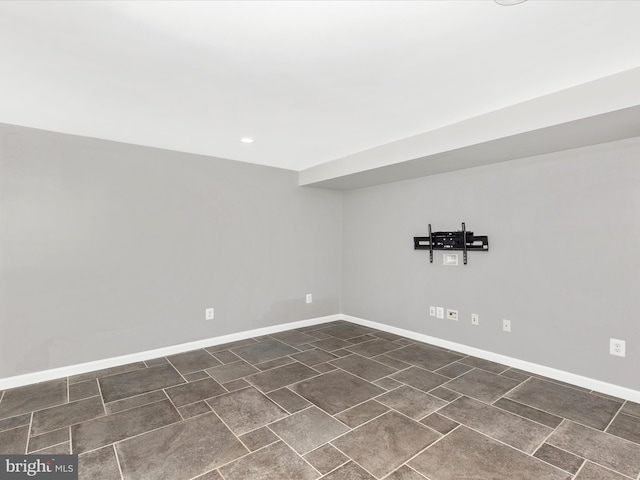 unfurnished room featuring baseboards and recessed lighting