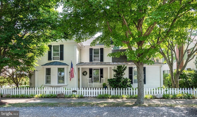 213 S Morris St, Oxford, MD 21654 - view of front of house with a shingled roof and covered porch