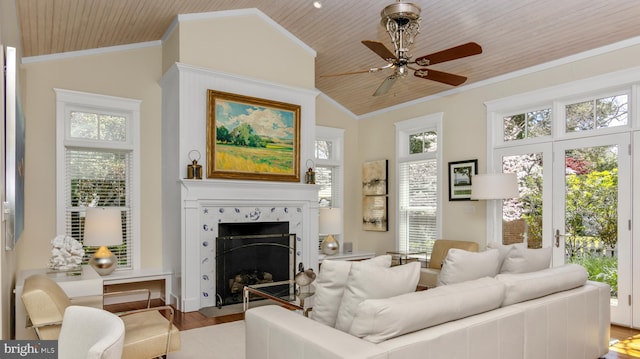 213 S Morris St, Oxford, MD 21654 - living area with a fireplace, vaulted ceiling, crown molding, and wooden ceiling