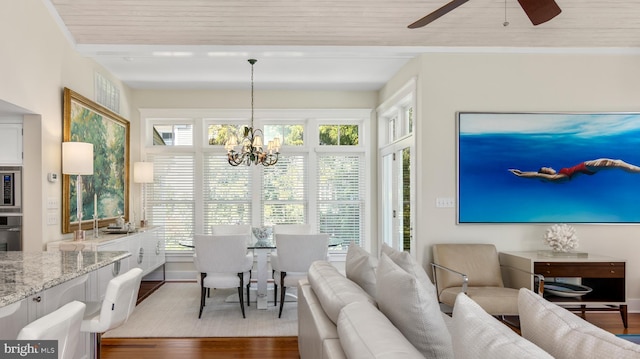213 S Morris St, Oxford, MD 21654 - interior space with wood finished floors and ceiling fan with notable chandelier