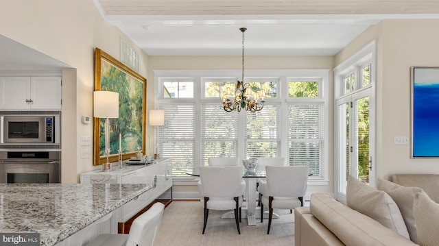 213 S Morris St, Oxford, MD 21654 - dining area featuring a chandelier