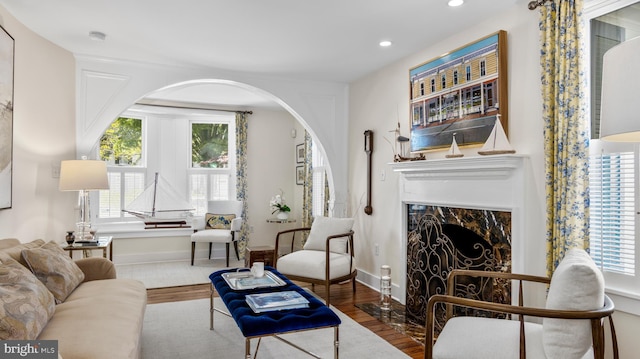213 S Morris St, Oxford, MD 21654 - living area with recessed lighting, wood finished floors, arched walkways, baseboards, and a fireplace