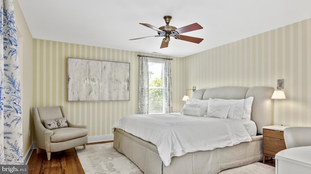 213 S Morris St, Oxford, MD 21654 - bedroom with ceiling fan, wood finished floors, and wallpapered walls