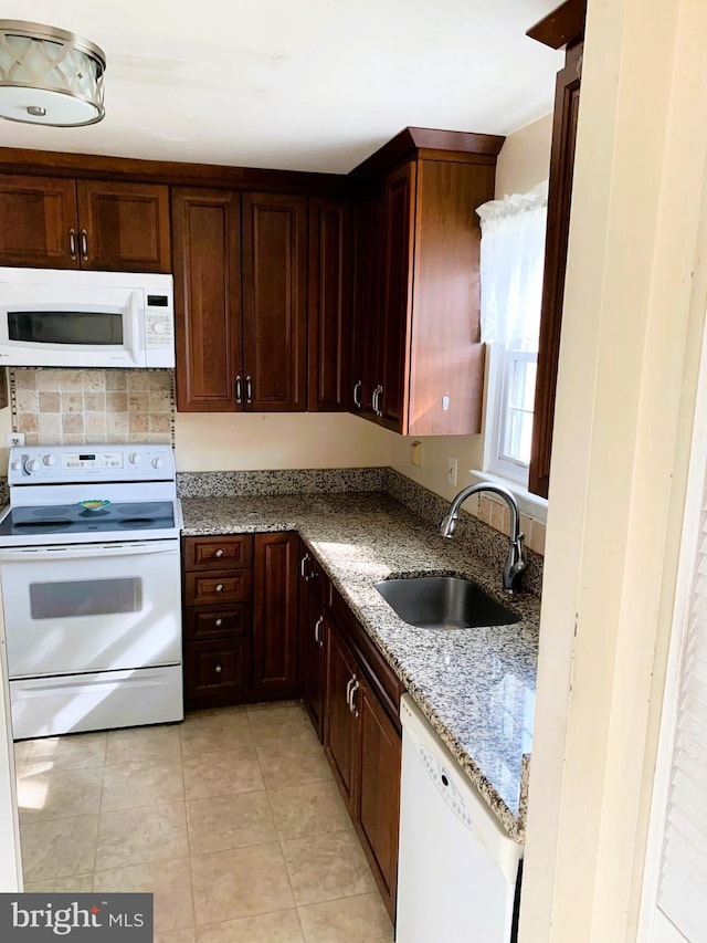 12 N Pendleton Ct Unit 11F, Frederick, MD 21701 - kitchen with white appliances, a sink, light stone counters, and light tile patterned flooring
