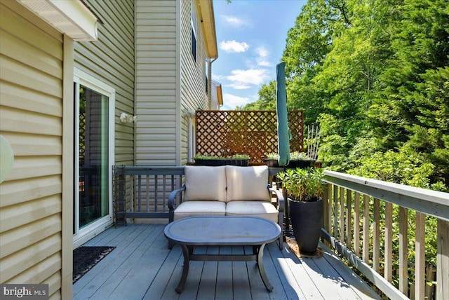 wooden terrace featuring an outdoor hangout area