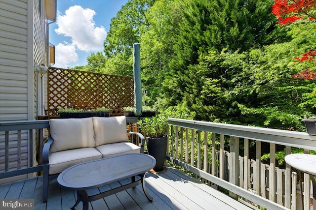 wooden deck featuring outdoor lounge area
