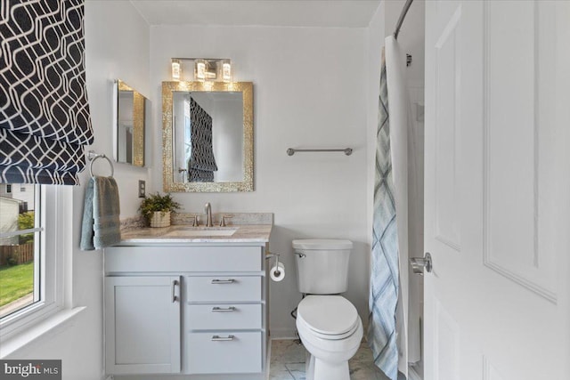 full bathroom featuring vanity and toilet