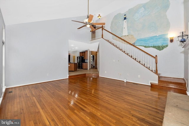 430 Timbermill Run, Emmitsburg, MD 21727 - unfurnished living room featuring hardwood / wood-style flooring, stairway, a ceiling fan, baseboards, and a towering ceiling