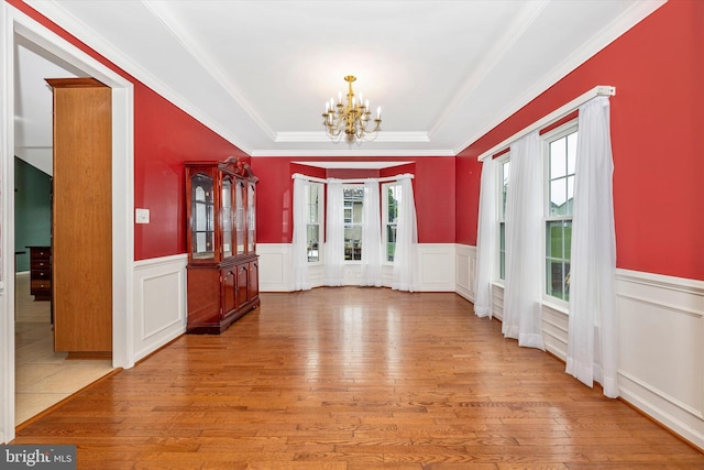 430 Timbermill Run, Emmitsburg, MD 21727 - unfurnished dining area featuring a chandelier, hardwood / wood-style floors, a tray ceiling, a wainscoted wall, and crown molding