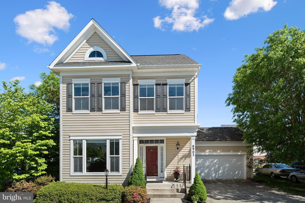 8903 Screech Owl Ct, Gainesville, VA 20155 - view of front of home with concrete driveway, a garage, and a shingled roof