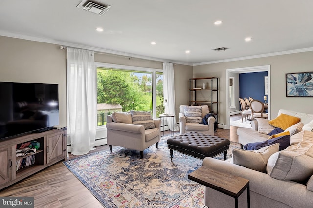 2609 Turf Valley Rd, Ellicott City, MD 21042 - living area featuring visible vents, ornamental molding, wood finished floors, recessed lighting, and a baseboard radiator