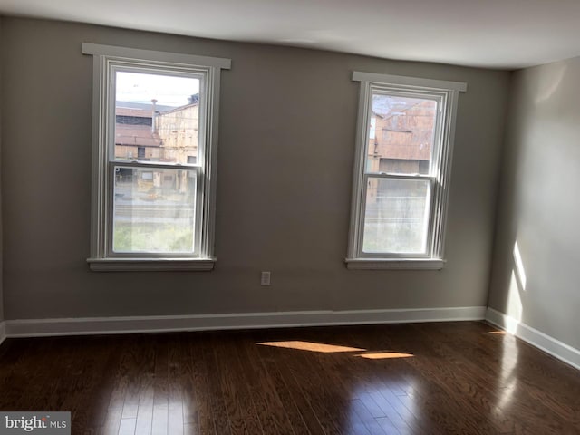 617 S Front St, Steelton, PA 17113 - unfurnished room with dark wood-type flooring, plenty of natural light, and baseboards