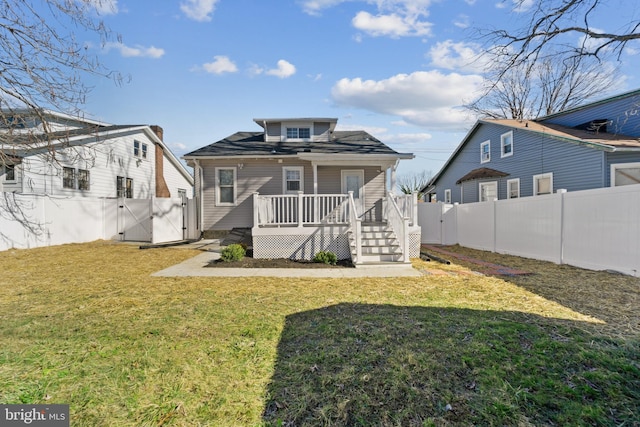 2808 Chelsea Ter, Baltimore, MD 21216 - rear view of house featuring a gate, a wooden deck, a fenced backyard, and a yard