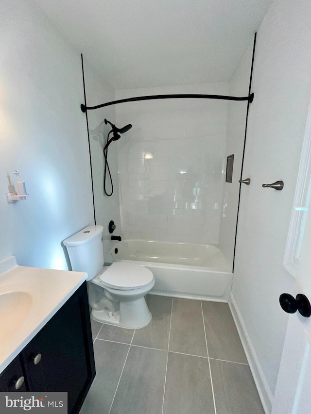 4658 Winterberry Ln, Oxon Hill, MD 20745 - bathroom with tile patterned flooring, vanity, toilet, tub / shower combination, and baseboards