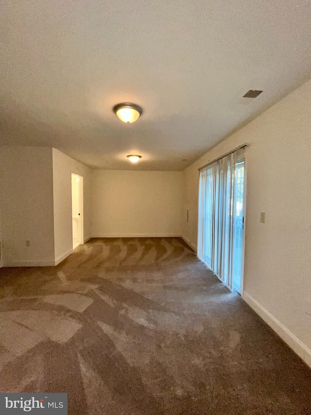4658 Winterberry Ln, Oxon Hill, MD 20745 - carpeted spare room with baseboards