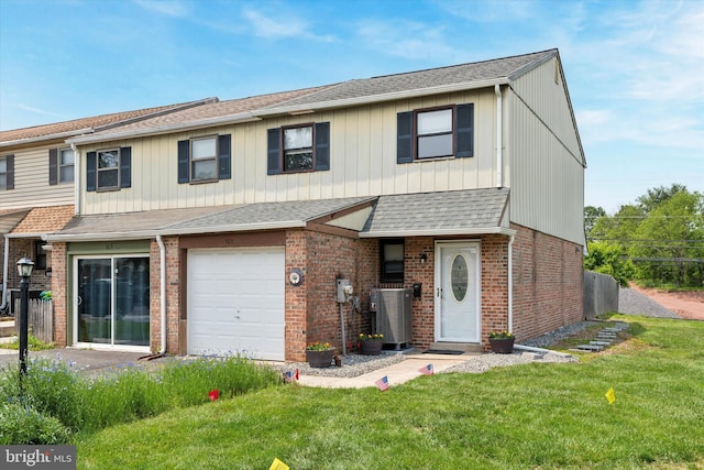102 Orchard Ct, Royersford, PA 19468 - view of property with a front yard, brick siding, a garage, and roof with shingles