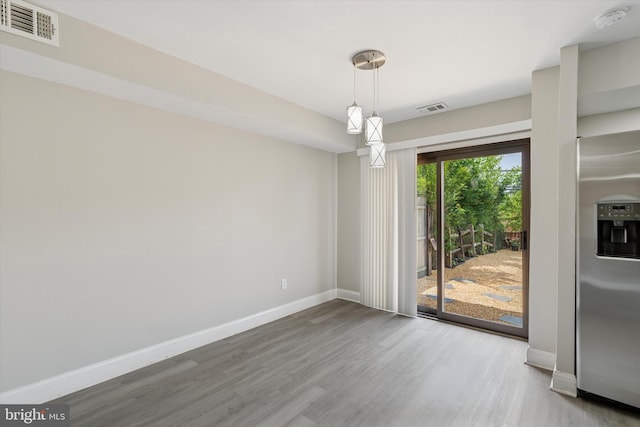 102 Orchard Ct, Royersford, PA 19468 - unfurnished dining area featuring wood finished floors and baseboards