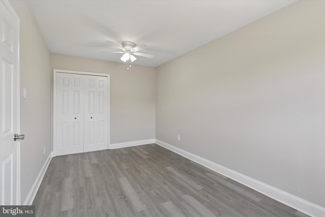 102 Orchard Ct, Royersford, PA 19468 - unfurnished bedroom with wood finished floors, baseboards, a closet, and a ceiling fan