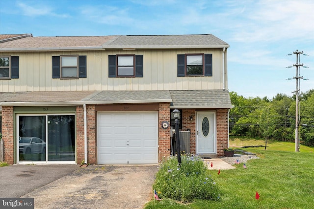 102 Orchard Ct, Royersford, PA 19468 - view of property featuring a front lawn, brick siding, an attached garage, roof with shingles, and asphalt driveway