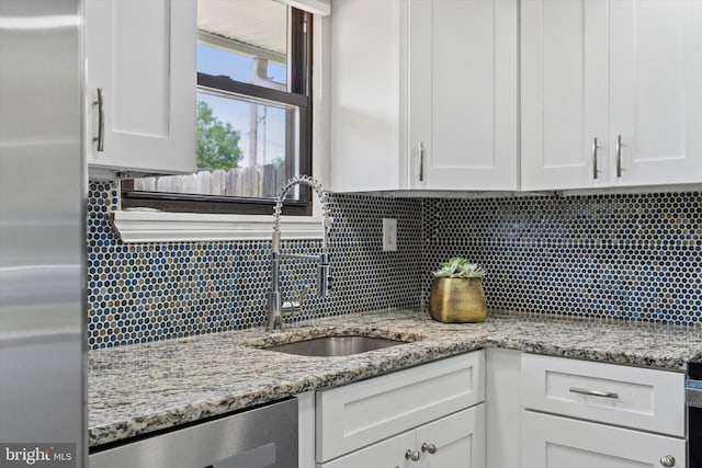 102 Orchard Ct, Royersford, PA 19468 - kitchen with stainless steel appliances, a sink, white cabinetry, and backsplash
