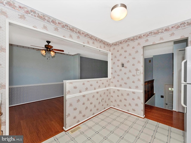 7250 Single Wheel Path, Columbia, MD 21046 - unfurnished room featuring wallpapered walls, tile patterned floors, and a ceiling fan