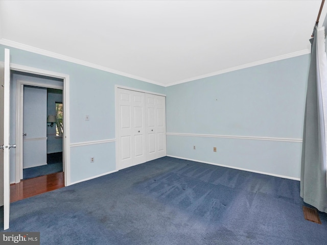 7250 Single Wheel Path, Columbia, MD 21046 - unfurnished bedroom with crown molding, dark carpet, baseboards, and a closet