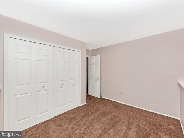 7250 Single Wheel Path, Columbia, MD 21046 - unfurnished bedroom with carpet flooring, a closet, and baseboards