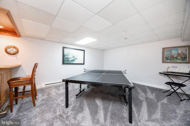playroom featuring baseboards, a baseboard radiator, carpet, and a drop ceiling