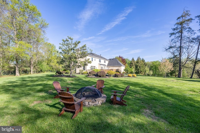 view of yard with a fire pit