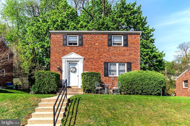 424 Hillside Rd, New Cumberland, PA 17070 - view of front facade with a front lawn and brick siding