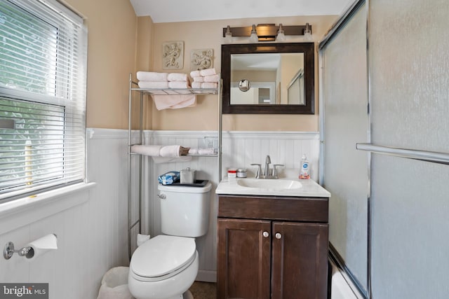 424 Hillside Rd, New Cumberland, PA 17070 - bathroom with vanity, wainscoting, a wealth of natural light, and toilet