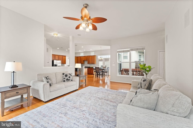 17435 Lethridge Cir, Round Hill, VA 20141 - living room with ceiling fan, light wood finished floors, recessed lighting, and a chandelier