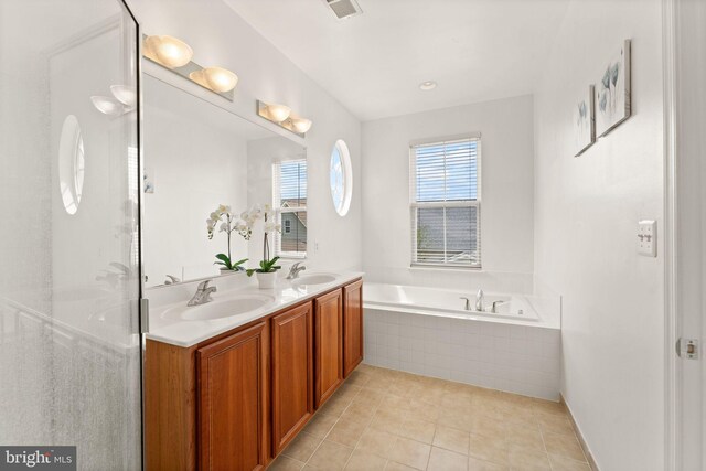 17435 Lethridge Cir, Round Hill, VA 20141 - bathroom with a garden tub, double vanity, and tile patterned floors