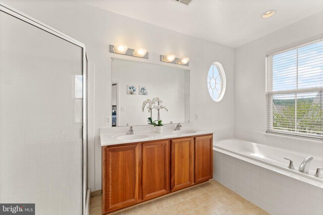 17435 Lethridge Cir, Round Hill, VA 20141 - bathroom with a bath, a stall shower, tile patterned floors, and double vanity