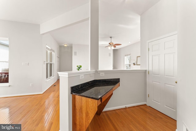 17435 Lethridge Cir, Round Hill, VA 20141 - kitchen featuring light wood-type flooring, a peninsula, ceiling fan, and baseboards