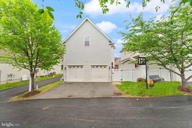 17435 Lethridge Cir, Round Hill, VA 20141 - view of front of property with driveway, a gate, an attached garage, and fence