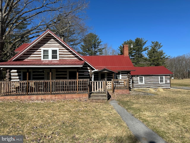 157 Old Tyrone Pike, Philipsburg, PA 16866 - log cabin with a chimney, a front yard, log exterior, and metal roof