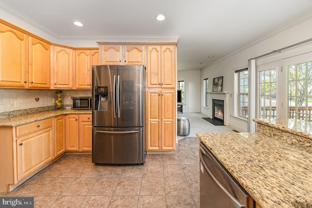 1901 Roxbury Ct, Mechanicsburg, PA 17055 - kitchen with crown molding, light stone counters, light brown cabinets, stainless steel appliances, and a fireplace with flush hearth
